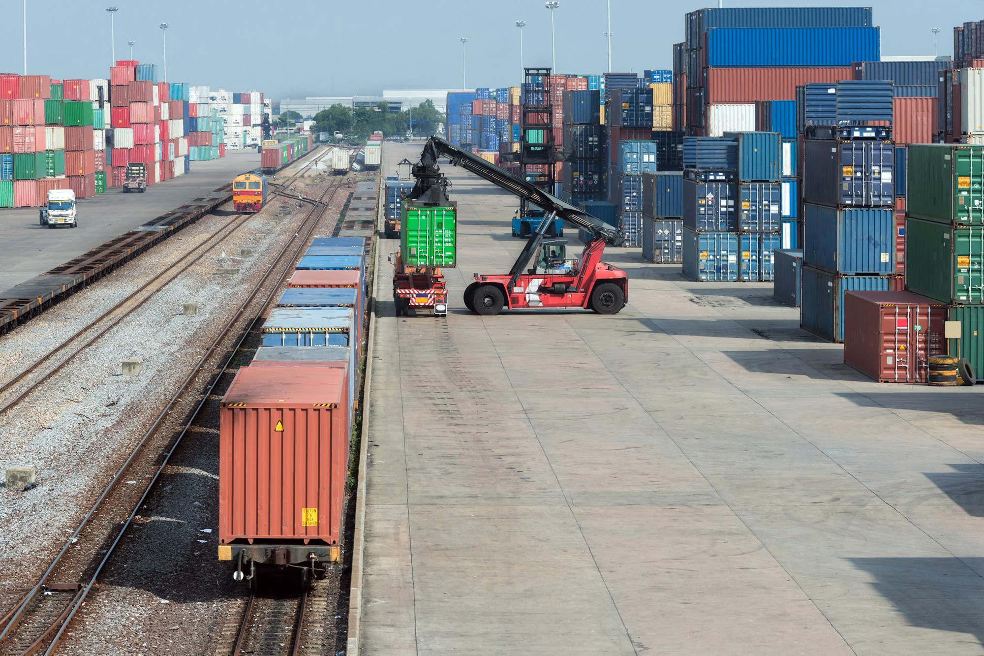 Cargo train platform with freight train container at depot